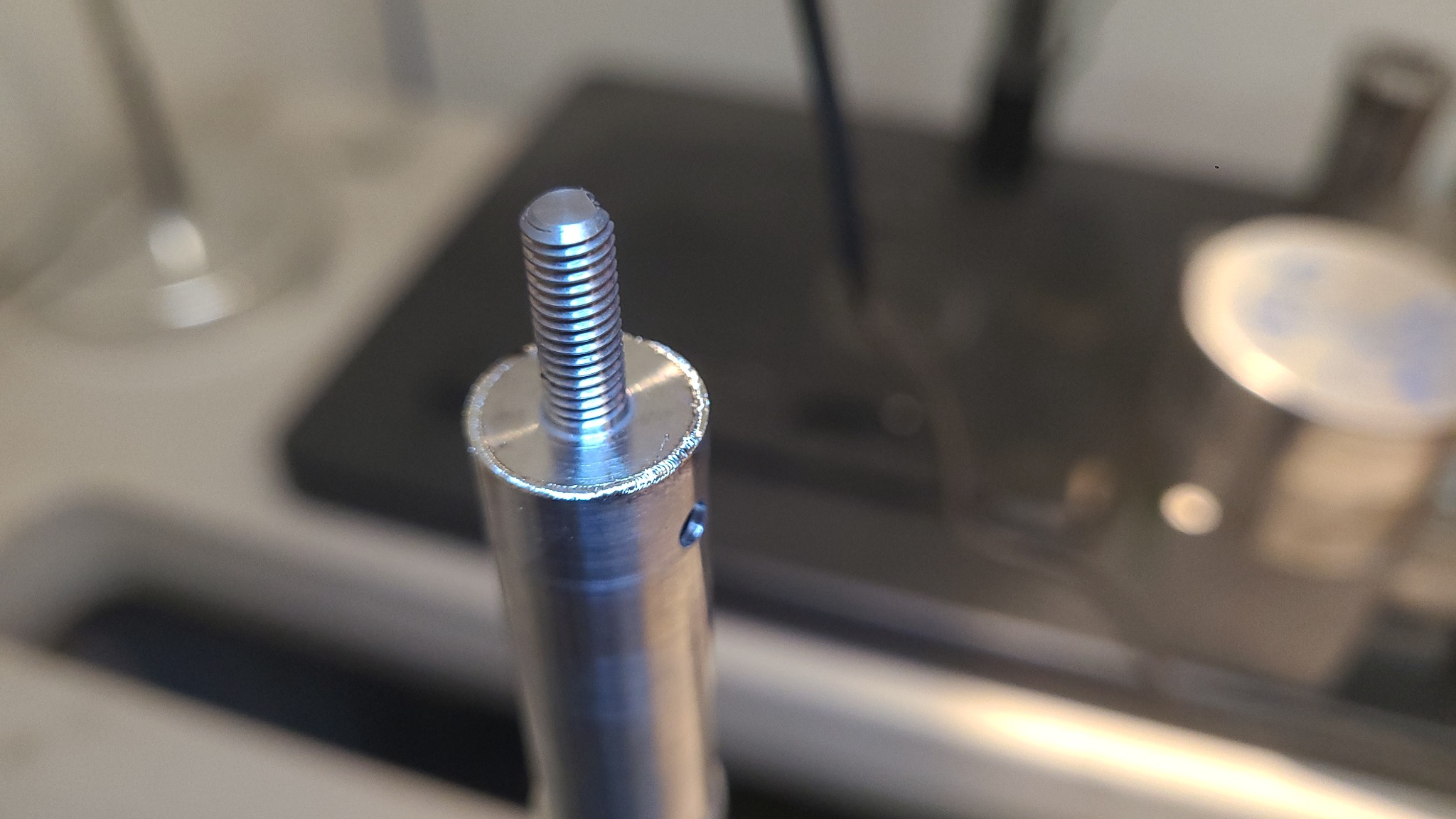 Close-up of a welded metal shaft assembly