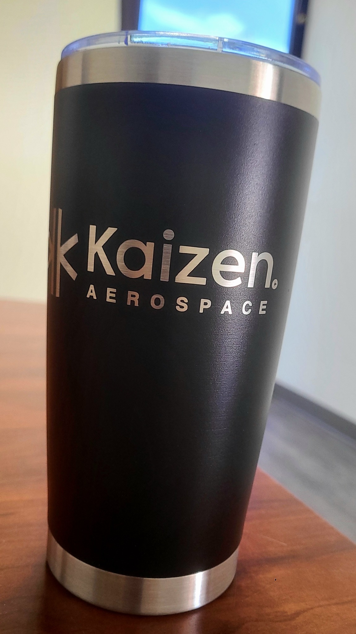 Company logo on a black tumbler by LA LASER 1