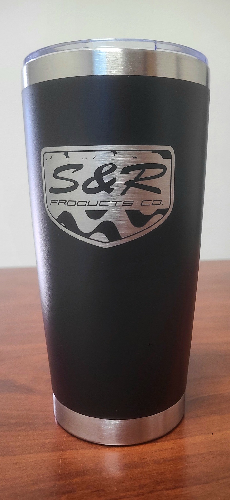 Custom emblem on a black tumbler by LA LASER 1