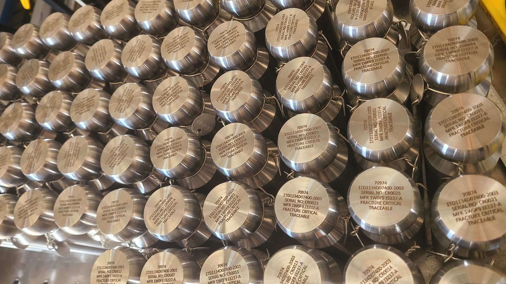 Batch of individually marked metal components at LA LASER 1